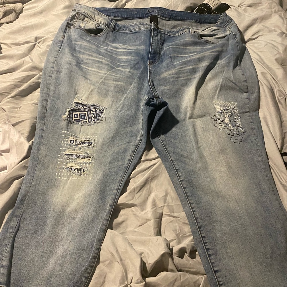Lane Bryant capri jeans with print under distressing